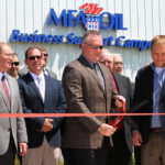 Mark Fenner, MFA Oil president and CEO, cuts the ribbon at the grand opening of the MFA Oil Business Support Campus in Moberly, Mo.