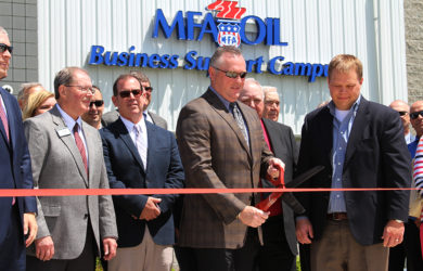 Mark Fenner, MFA Oil president and CEO, cuts the ribbon at the grand opening of the MFA Oil Business Support Campus in Moberly, Mo.