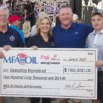 Pictured left to right: John Laws, chairman of the KS/MO Operation Homefront Advisory Board; Kristin Castle, central Midwest program manager for Operation Homefront; Mark Fenner, MFA Oil president and CEO; and Brandon Perry, senior airman with the U.S. Air Force.