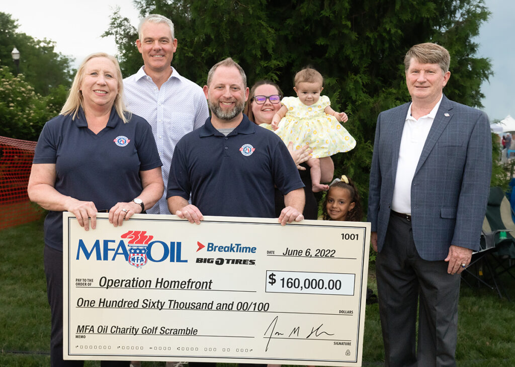 Pictured L to R: Sarah Cheesman, Operation Homefront Region 2 West Area Manager; Jon Ihler, MFA Oil President and CEO; AJ Kahn, Operation Homefront Region 2 East Area Manager; Whitney, Lyvina and Nova Alamo, active-duty military family members; and Brig Gen Robert D. Thomas, USAF, Retired, COO, Operation Homefront.