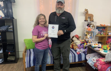 MFA Oil Plant Manager Dan Schaefer presents a grant to Faith Bridge Executive Director Andie Jamerson (Moberly, Mo.).