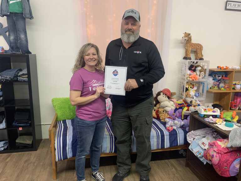 MFA Oil Plant Manager Dan Schaefer presents a grant to Faith Bridge Executive Director Andie Jamerson (Moberly, Mo.).