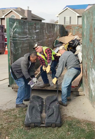 Members of St. Paul's Lutheran Church in Concordia, Mo., use their disaster relief trailer to help clear debris following destructive storms and provide homeowners with assistance in cleanup efforts.