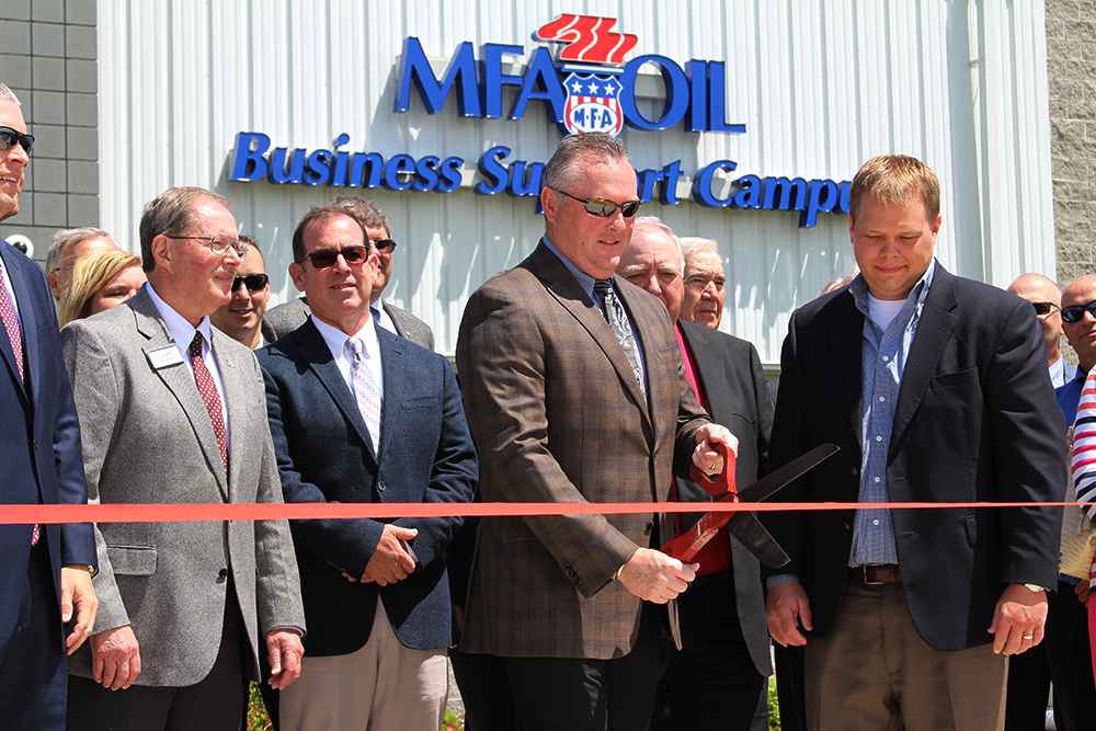 Mark Fenner, MFA Oil president and CEO, cuts the ribbon at the grand opening of the MFA Oil Business Support Campus in Moberly, Mo.