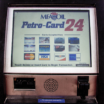 A fuel pump display showing the Petro-Card 24 service. The screen lists accepted cards, including MasterCard, Voyager, Wright Express, Visa, and Discover. Instructions prompt users to touch the screen or insert a card to start a transaction.