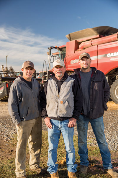 Mart Thaxton (center) completed his 42nd harvest this fall. He farms with his sons, Clayton (left) and Keaton (right), near Carlisle, Ark., where they raise corn, soybeans and rice. Photo by Sara Reeves.